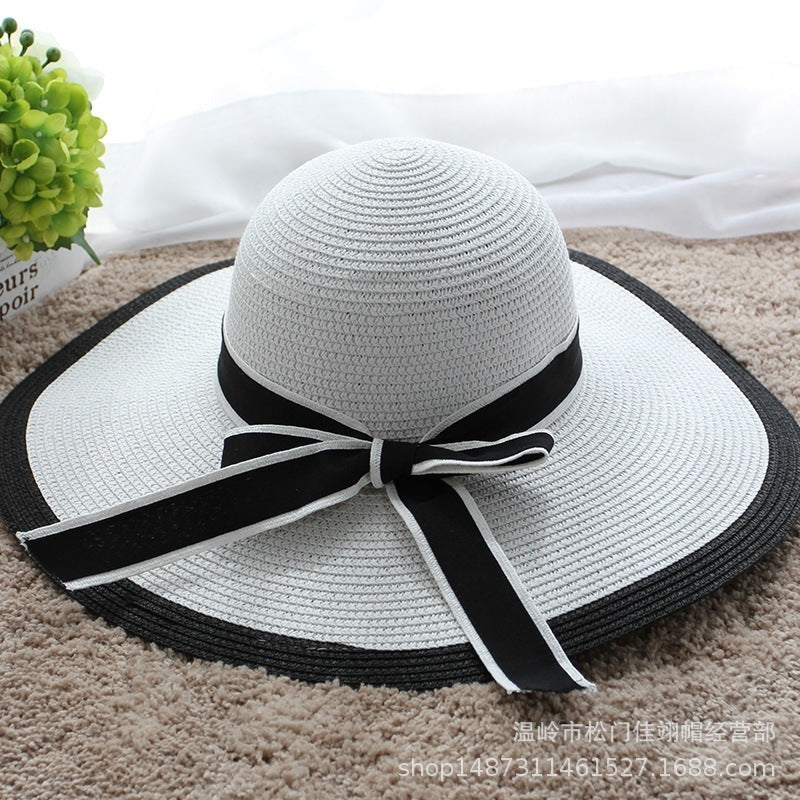 Vente chaude mode Hepburn chapeau vent noir blanc rayé nœud papillon été chapeau de soleil belle femmes paille plage chapeau large bord casquette