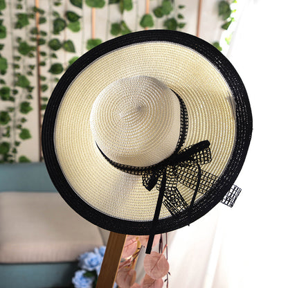 Vente chaude mode Hepburn chapeau vent noir blanc rayé nœud papillon été chapeau de soleil belle femmes paille plage chapeau large bord casquette