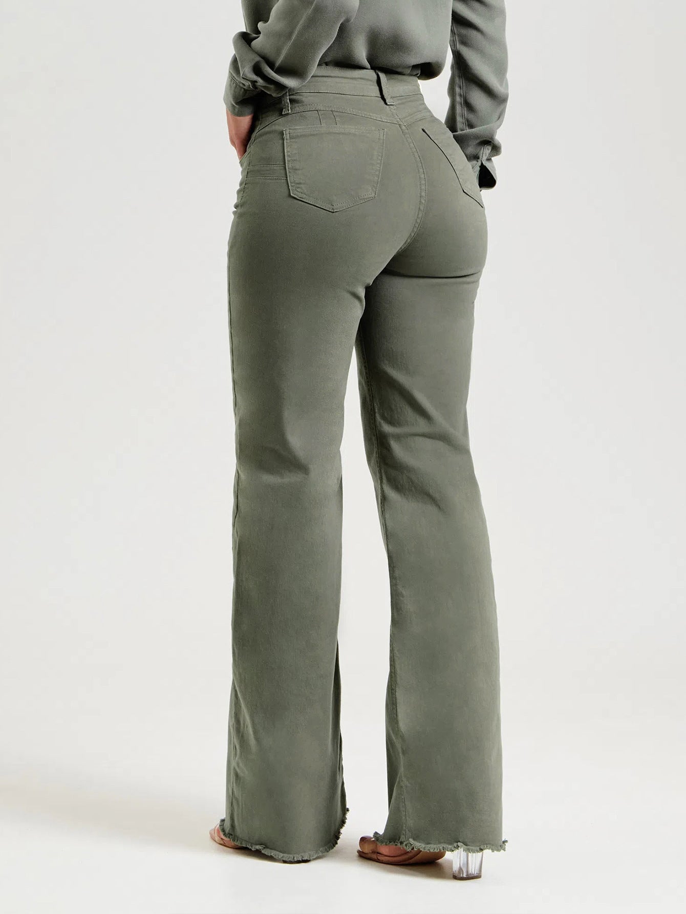 Pantalon évasé effiloché de couleur unie à la mode et coupe slim