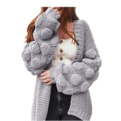 Joli pull épais et long cardigan à pompons