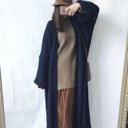 Cardigan long tricoté coupe-vent au-dessus du genou