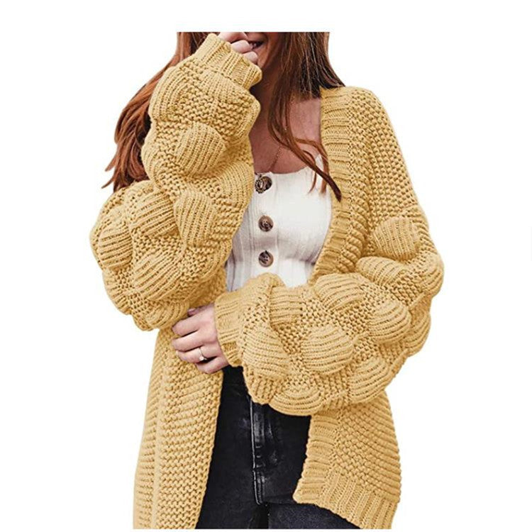 Joli pull épais et long cardigan à pompons