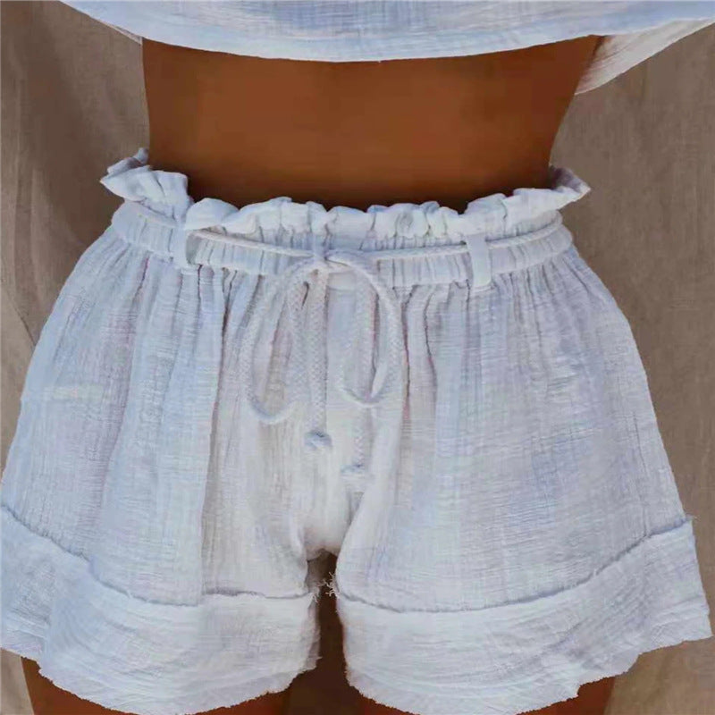 Short taille haute en coton et lin style bohème avec ceinture élastique plissée ample de couleur unie